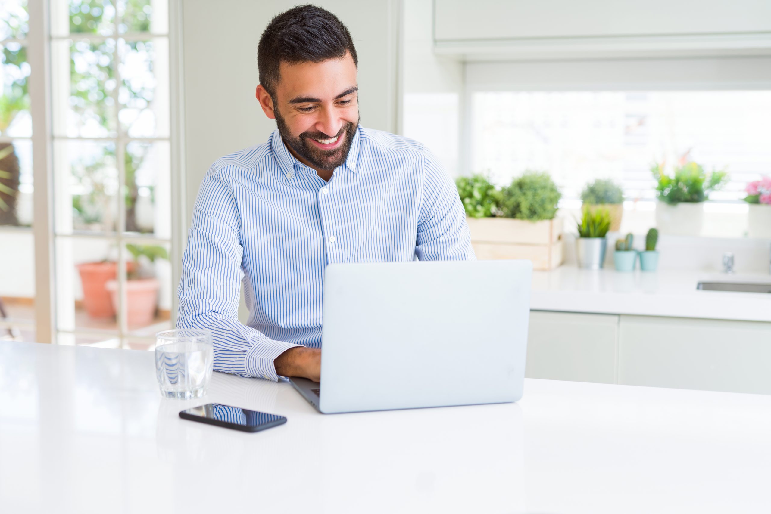 Business man smiling working using computer laptop
